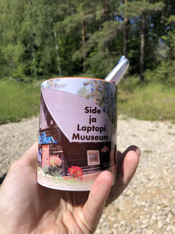 Ultra limited edition "Side ja laptopi muuseum" mug. Inside are some pens, two of them belonging to a telecommunications
company EMT.